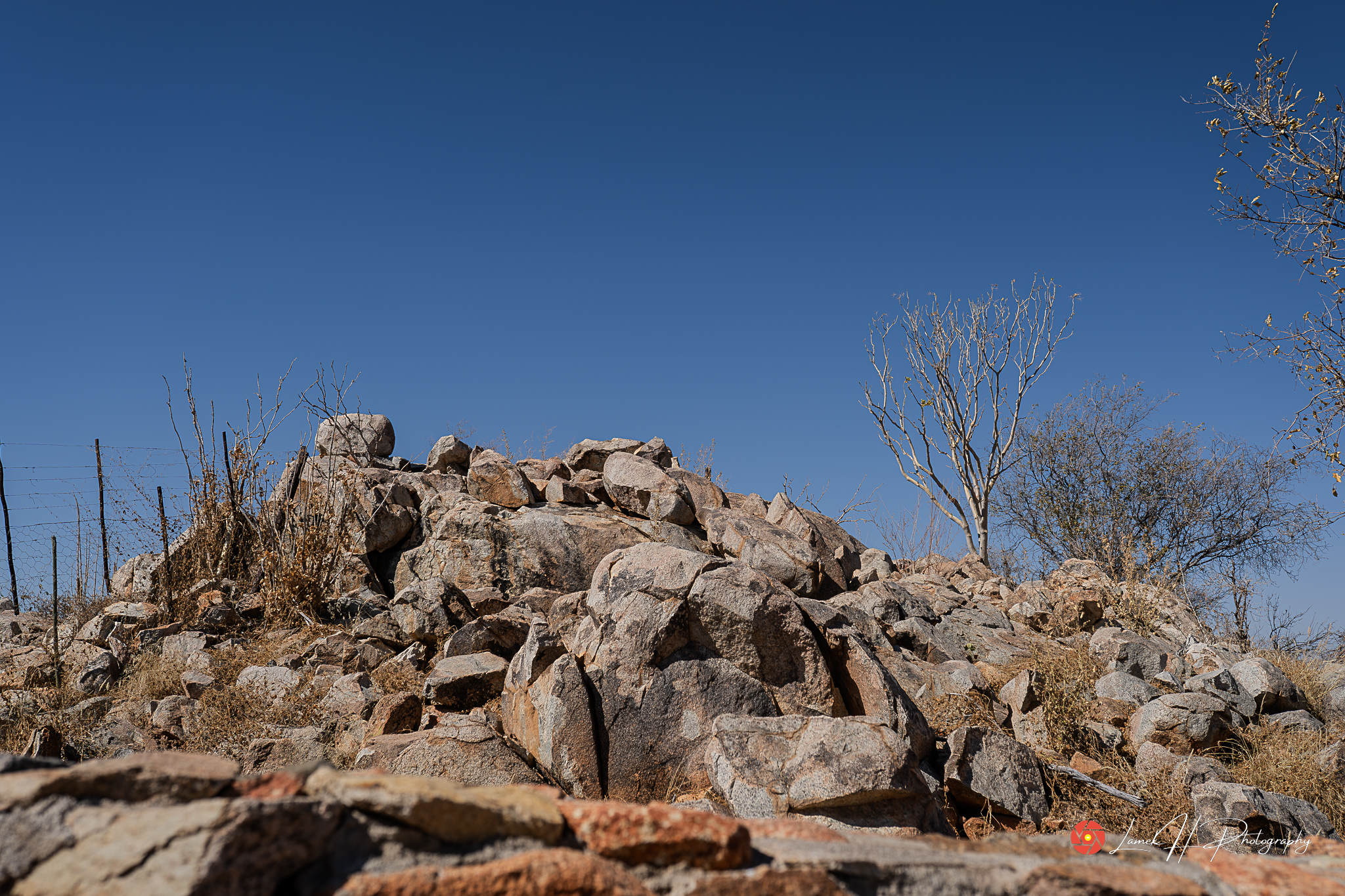 Colorful sky with dramatic clouds over an open African plain