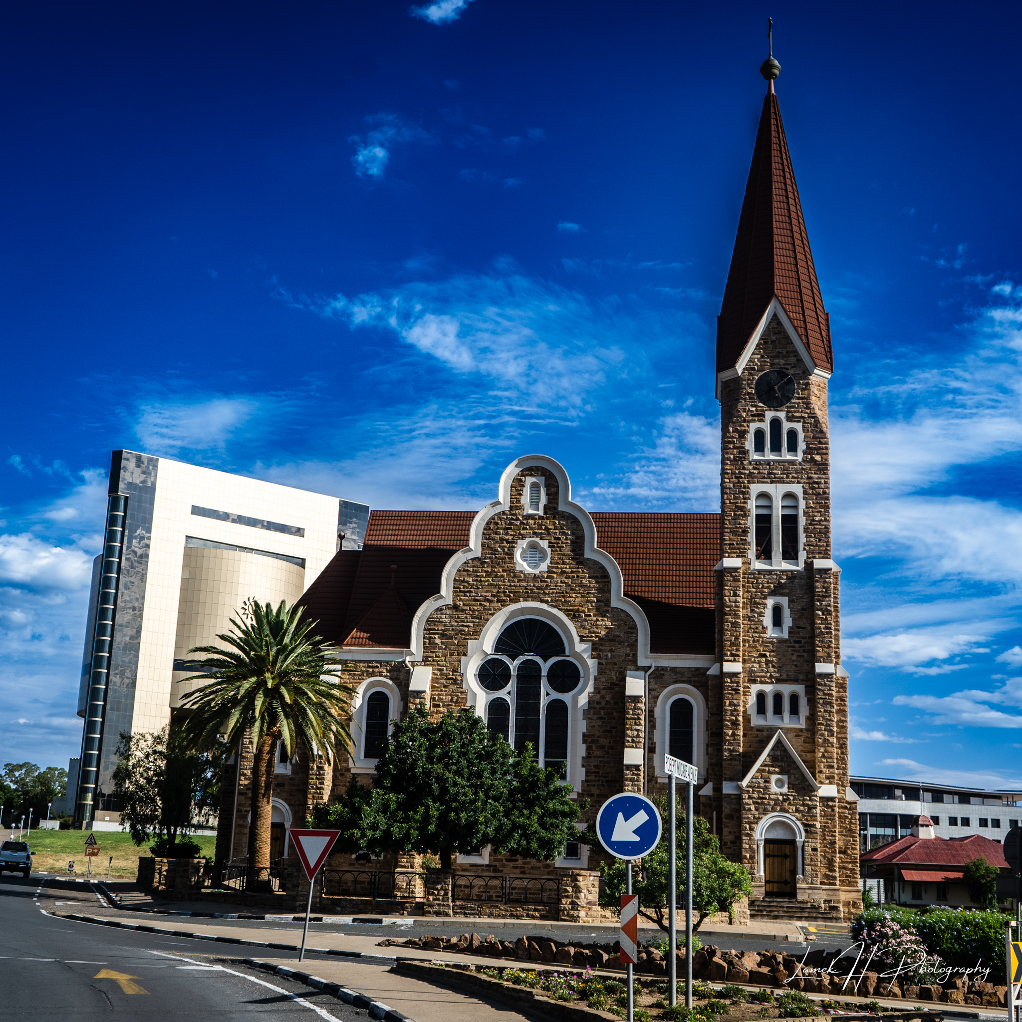 Vast savannah plains with acacia trees under a golden sunrise