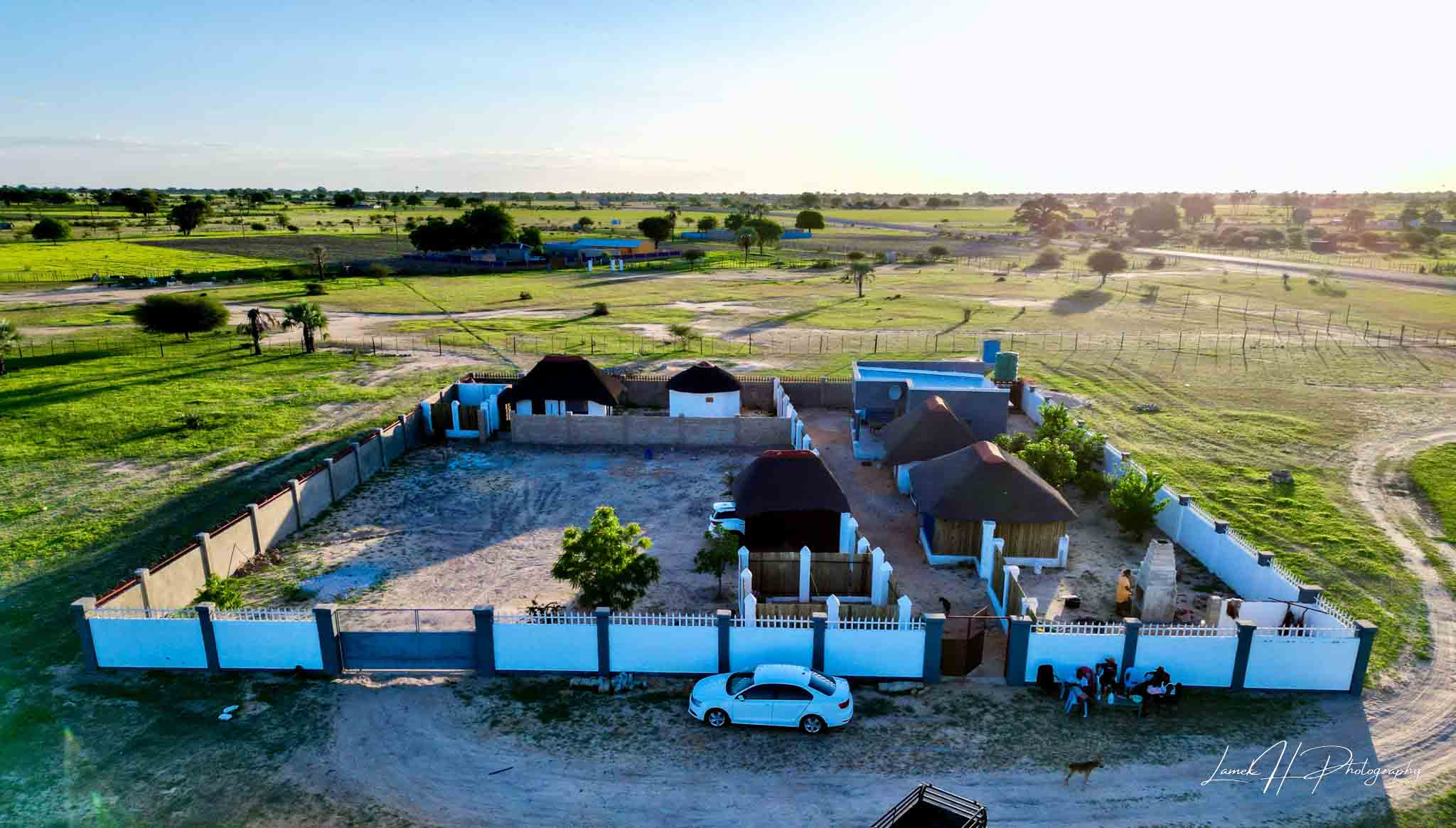 Namibian desert road stretching into the horizon at sunrise